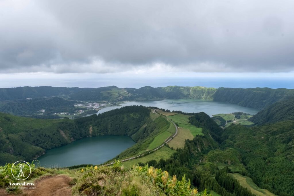 Spectacular view from Miradouro da Grota do Inferno, a scenic lookout point offering breathtaking vistas of São Miguel's landscapes. Lush greenery, rolling hills, and the natural beauty of the Azores unfold in this captivating panoramic scene