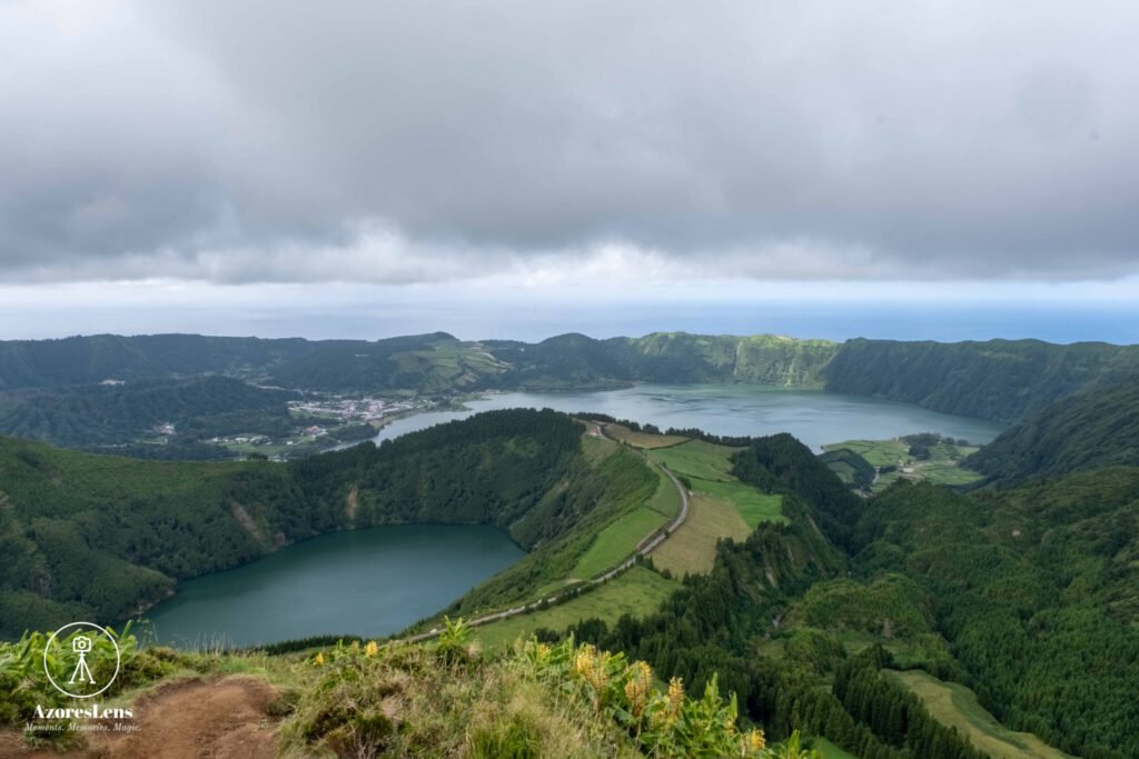 Spectacular view from Miradouro da Grota do Inferno, a scenic lookout point offering breathtaking vistas of São Miguel's landscapes. Lush greenery, rolling hills, and the natural beauty of the Azores unfold in this captivating panoramic scene
