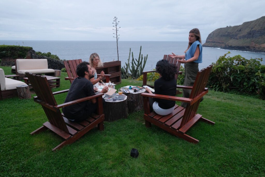 art activity in front of the ocean, green grass, blue sky, Sao Miguel Island